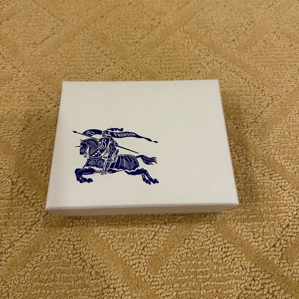 Burberry Box 6.5 inches by 5 inches
Comes with a pouch for the wallet and tags
